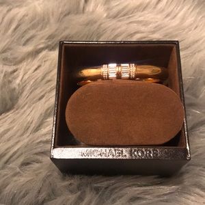 Gold bangle.